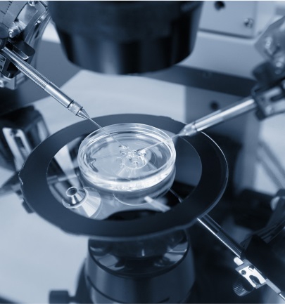 petri dish in a machine with droppers